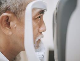A man using a retinal imaging machine