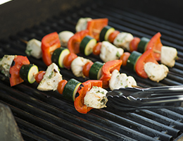 Veggie kebabs on a grill. 