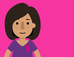  A woman with a breast cancer awareness ribbon on her shirt